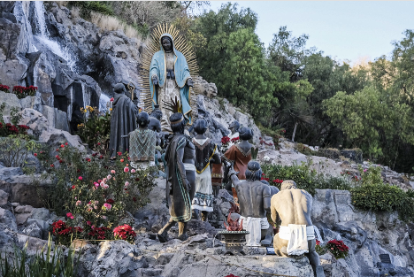 Representation of indigenous Aztecs venerating the Virgin of Guadalupe.