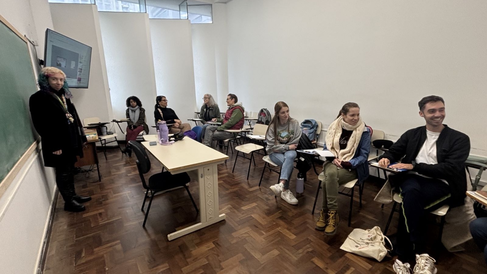 IPAST classroom showing instructor Bianca and students in desks