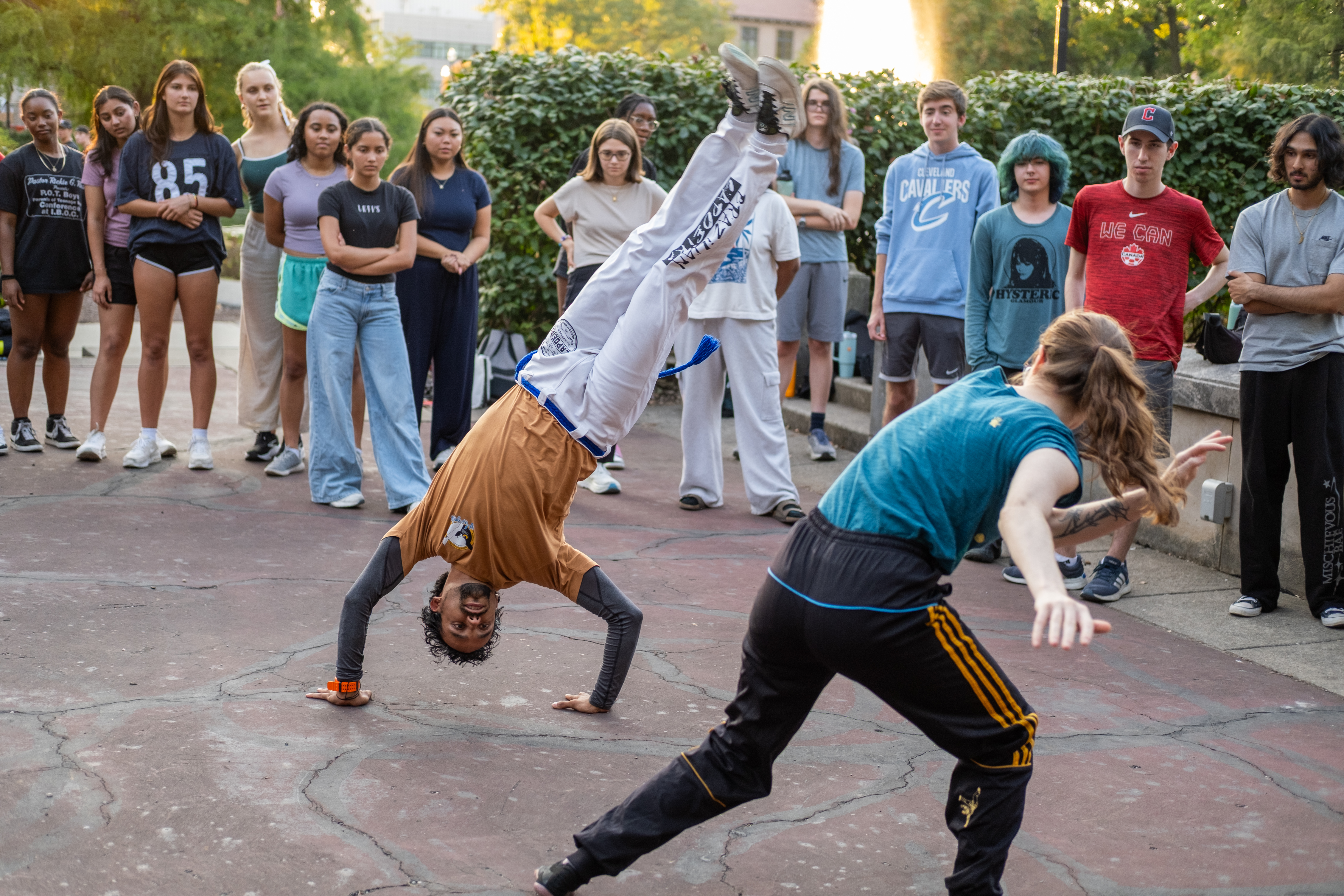 Julio Beltran demonstrating an acrobatic movement in a capoeira game