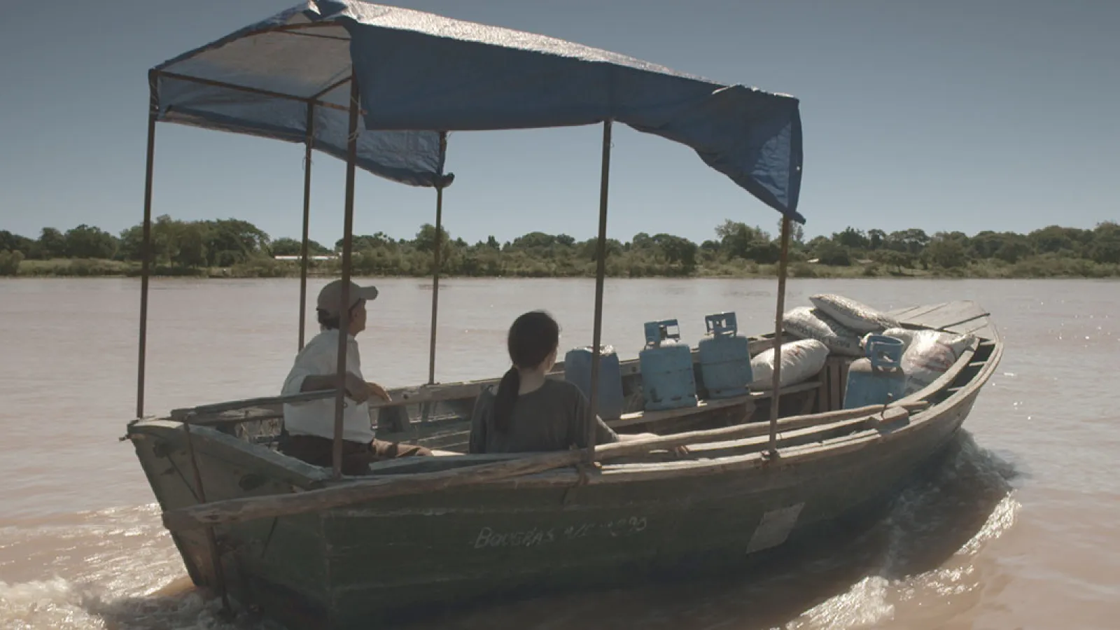 woman and men on a small boat