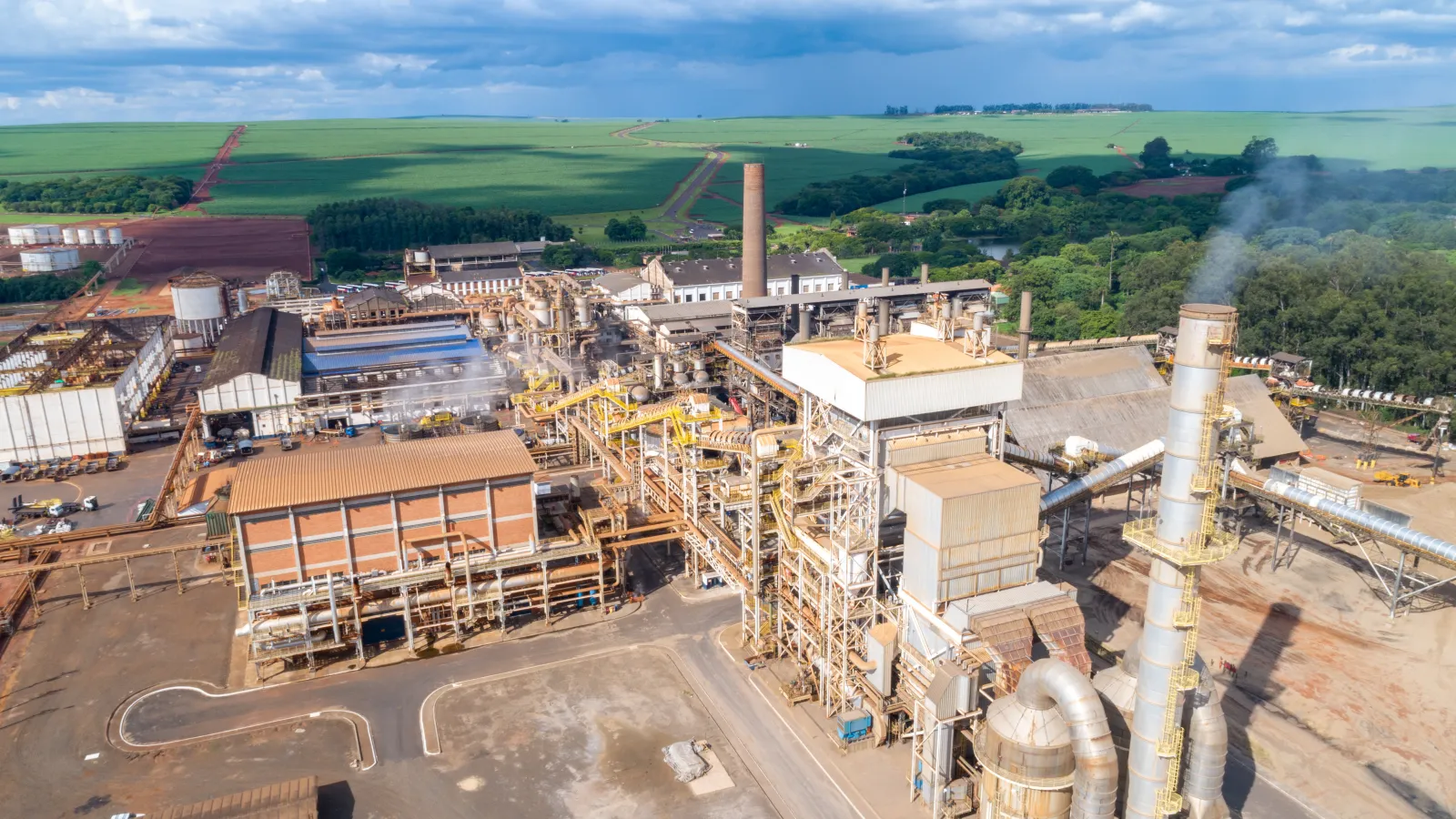 Sugar cane industrial mill processing plant in Brazil. Sugarcane plant producing renewable energy. Ethanol.