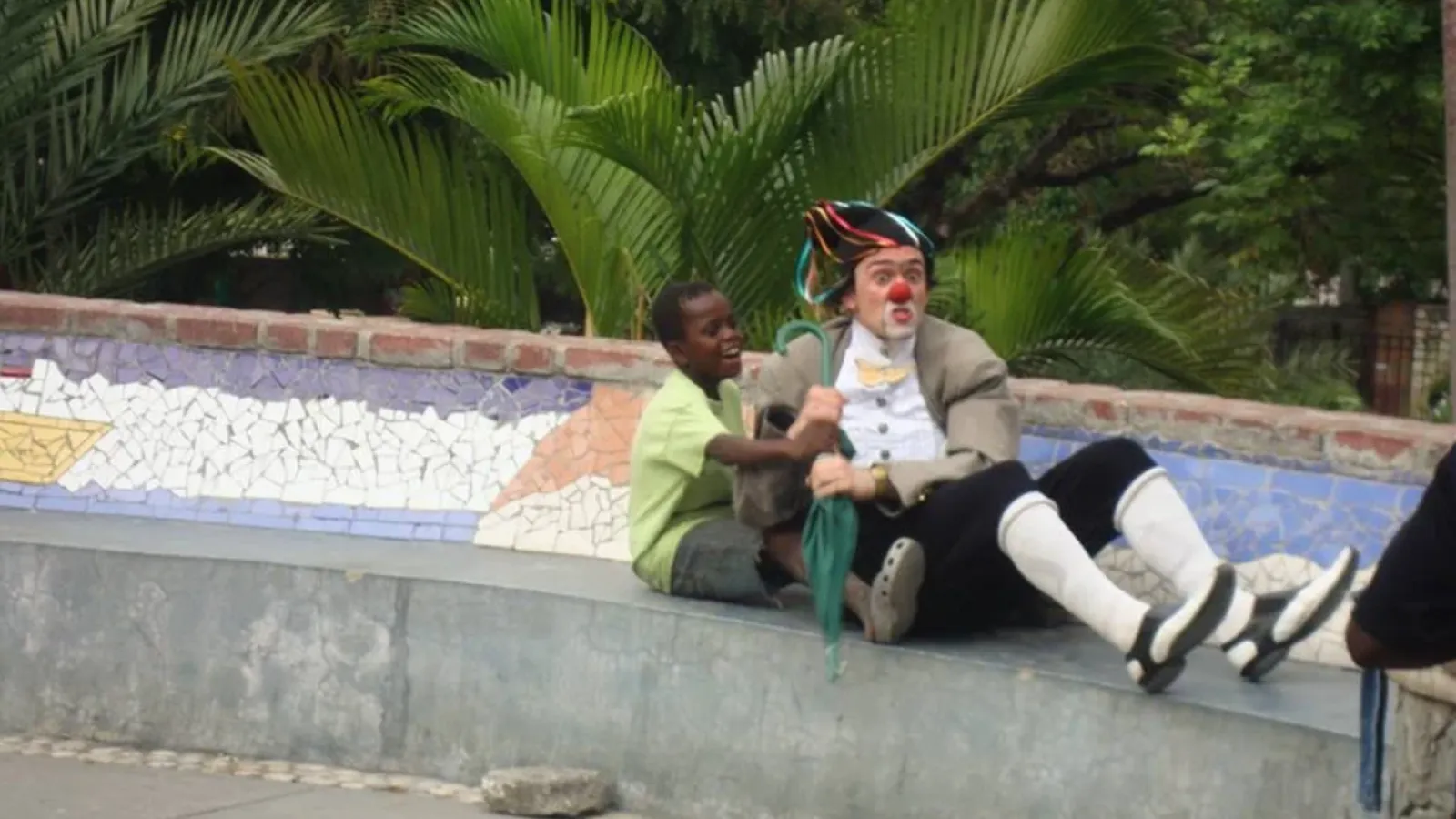 boy and clown pretending to be on a boat