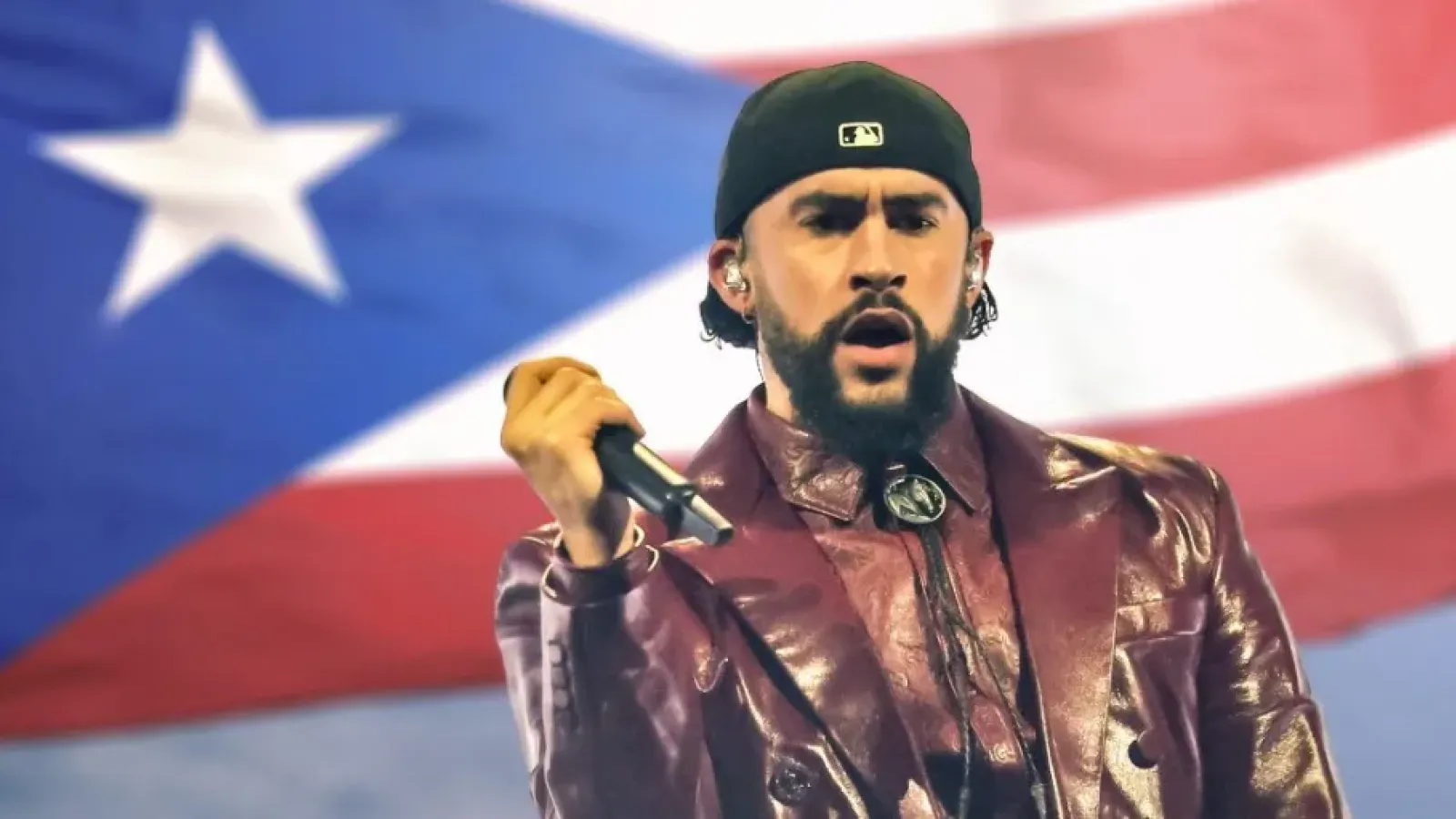 Bad Bunny in front of Puerto Rican flag