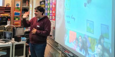 Raphael Palermo facilitates a video conference between students in the U.S. and Brazil