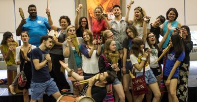 Everyone is a teacher and learner in MAS ALLA Teachers and students playing Andean instruments in a group photo