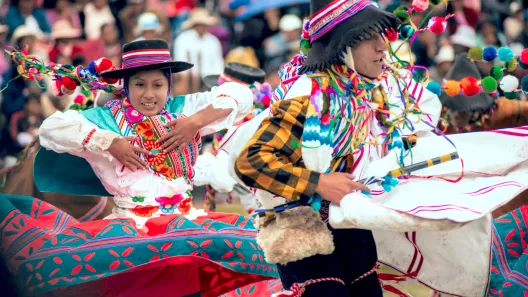 man and woman in indigenous clothing dancing