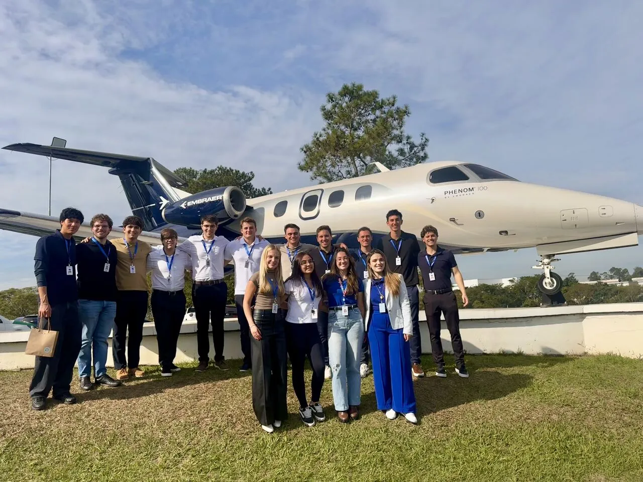 group of people in front of small plane