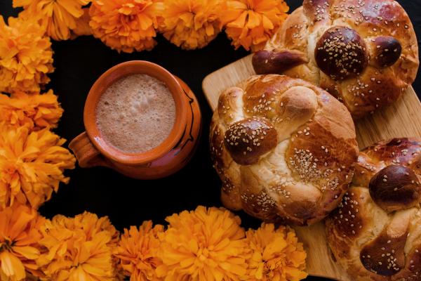 Pan de muerto, hot cocoa, marigolds