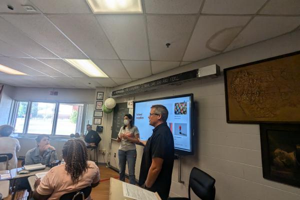 Scott, Leila and Julio presenting in a classroom