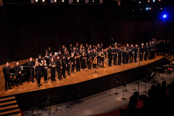 Performers at the Latin American Music Celebration Final Concert gather on stage to take a bow.
