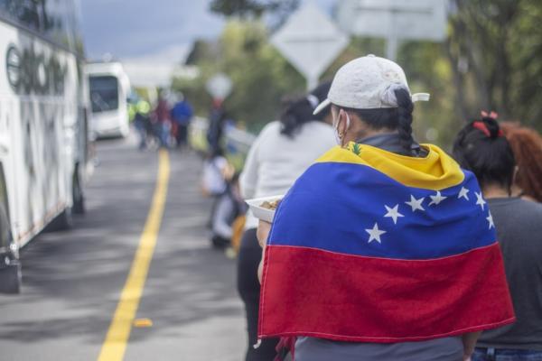 woman with Venezuelan flag on her back
