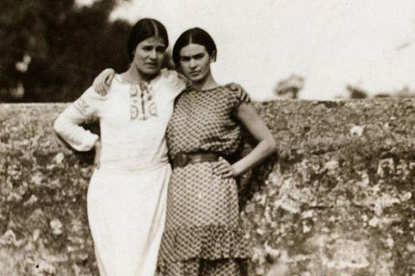 two women (Tima Modotti and Frida Kahlo) standing, black and white