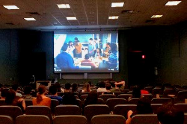 High School Students watching the movie Nosotros los nobles in a lecture hall