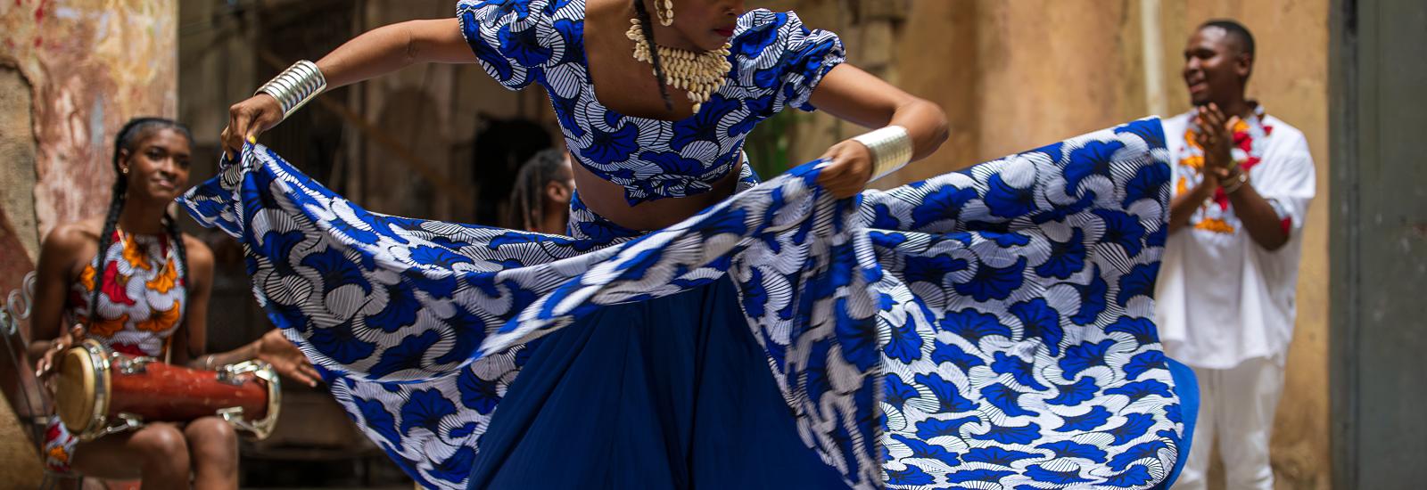 woman dancing in blue dress